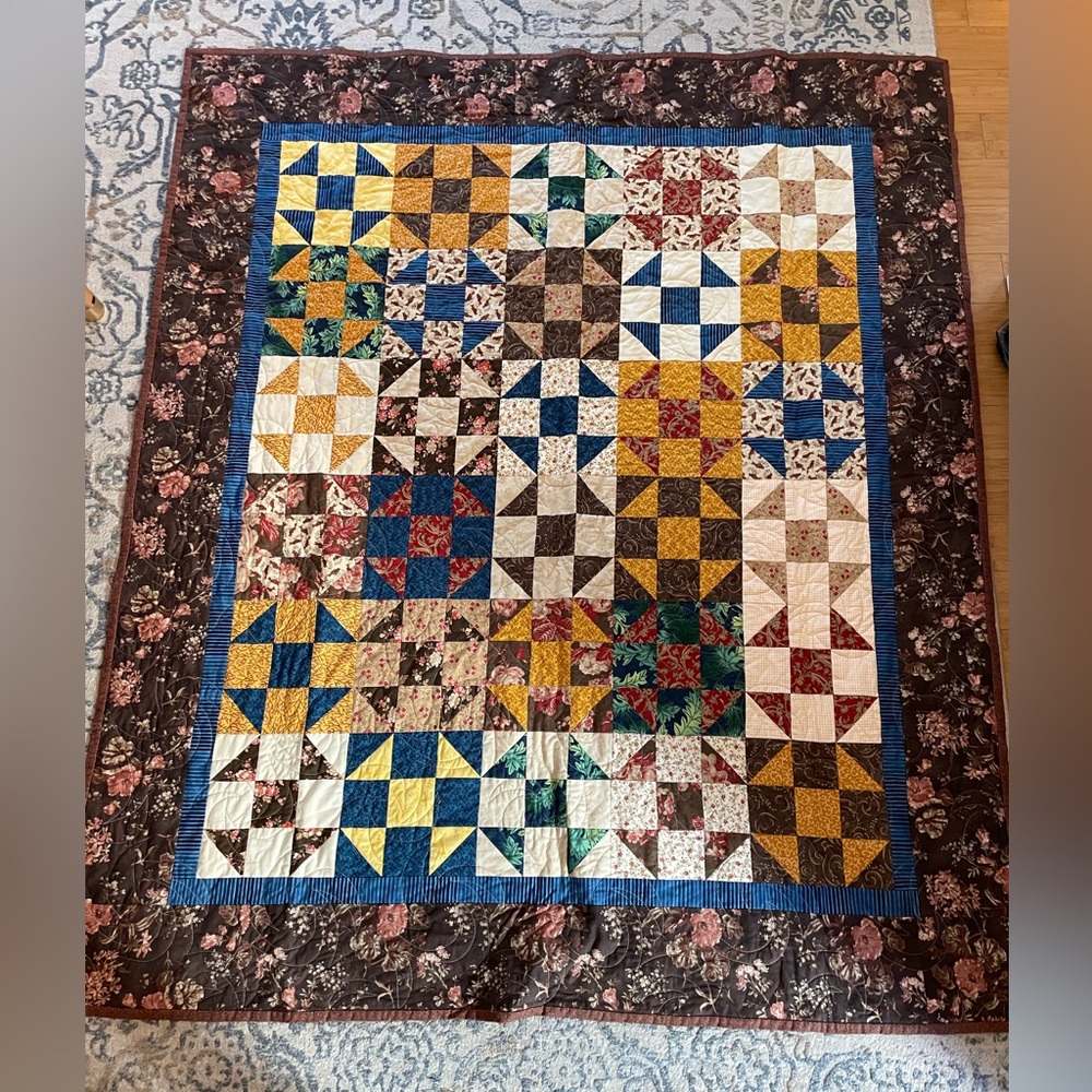 57” by 65.5” Handmade machine quilted patchwork quilt signed New condition!
